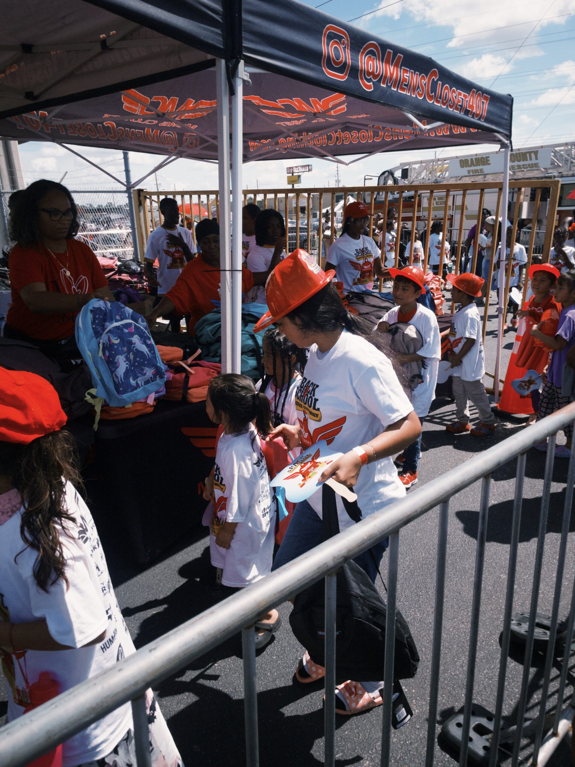 Kids receiving backpacks